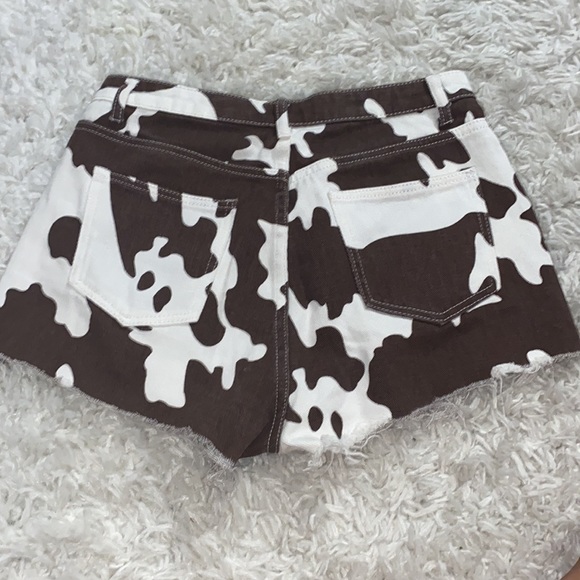 Women's Cow Print Raw Hem Denim Shorts - Picture 3 of 3